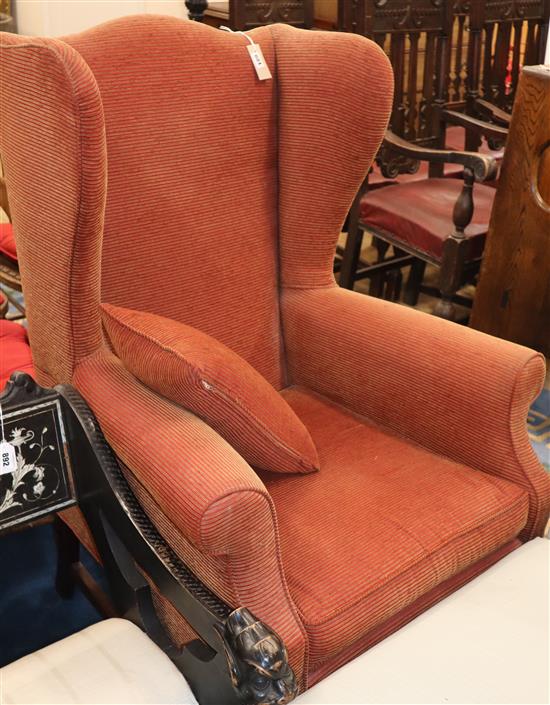A reproduction Georgian style wing armchair